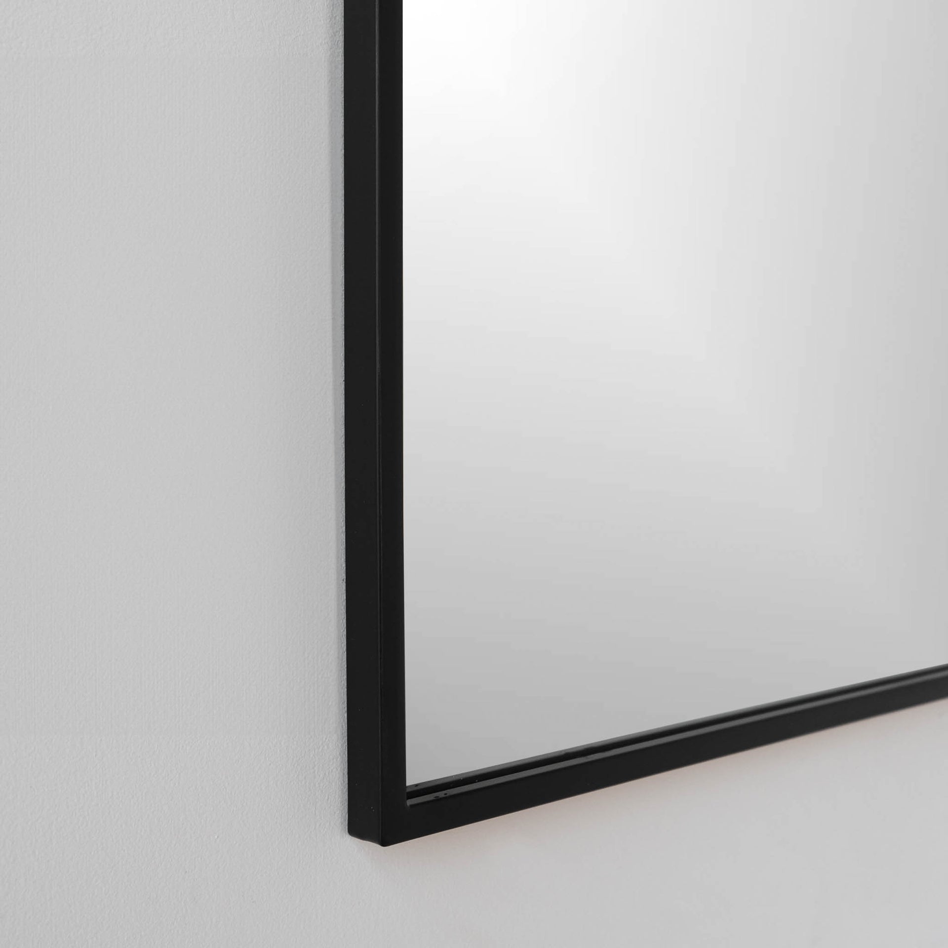 Black iron frame view of Tudor inspired mirror