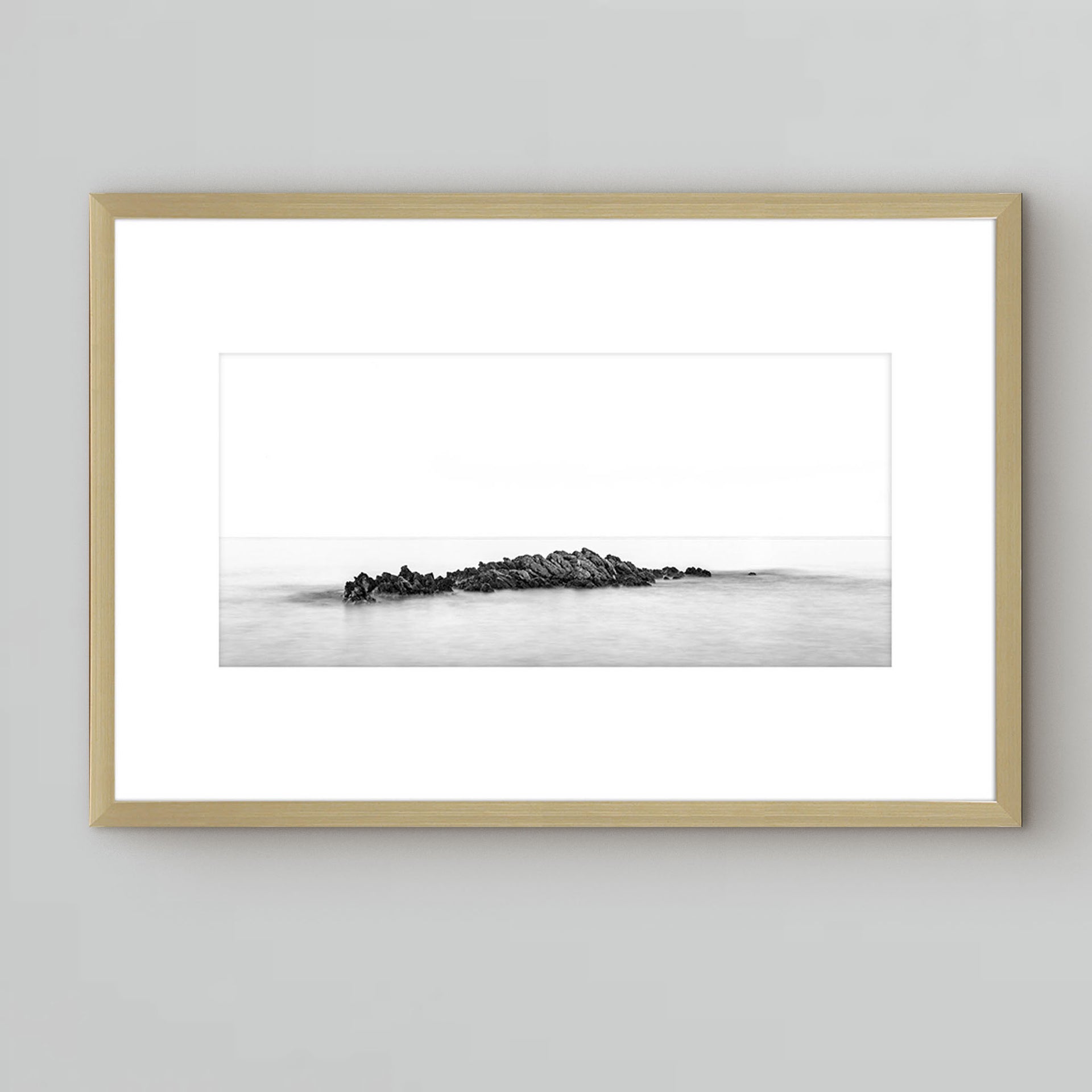 photography under glass of rocks in the ocean, gold frame