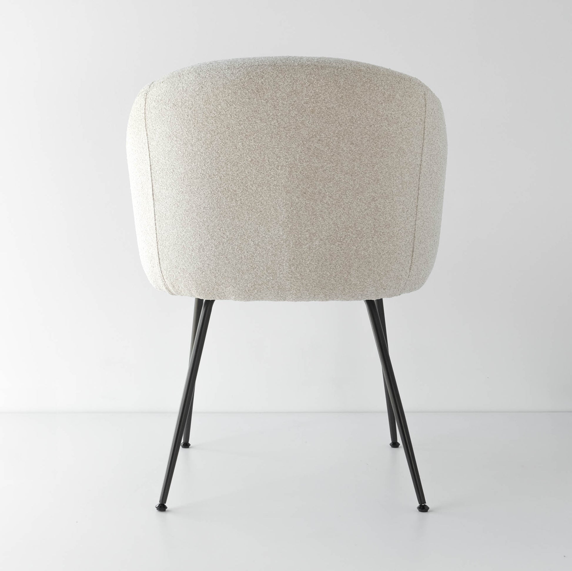 Back view of soft curve of oatmeal elegant dining chairs