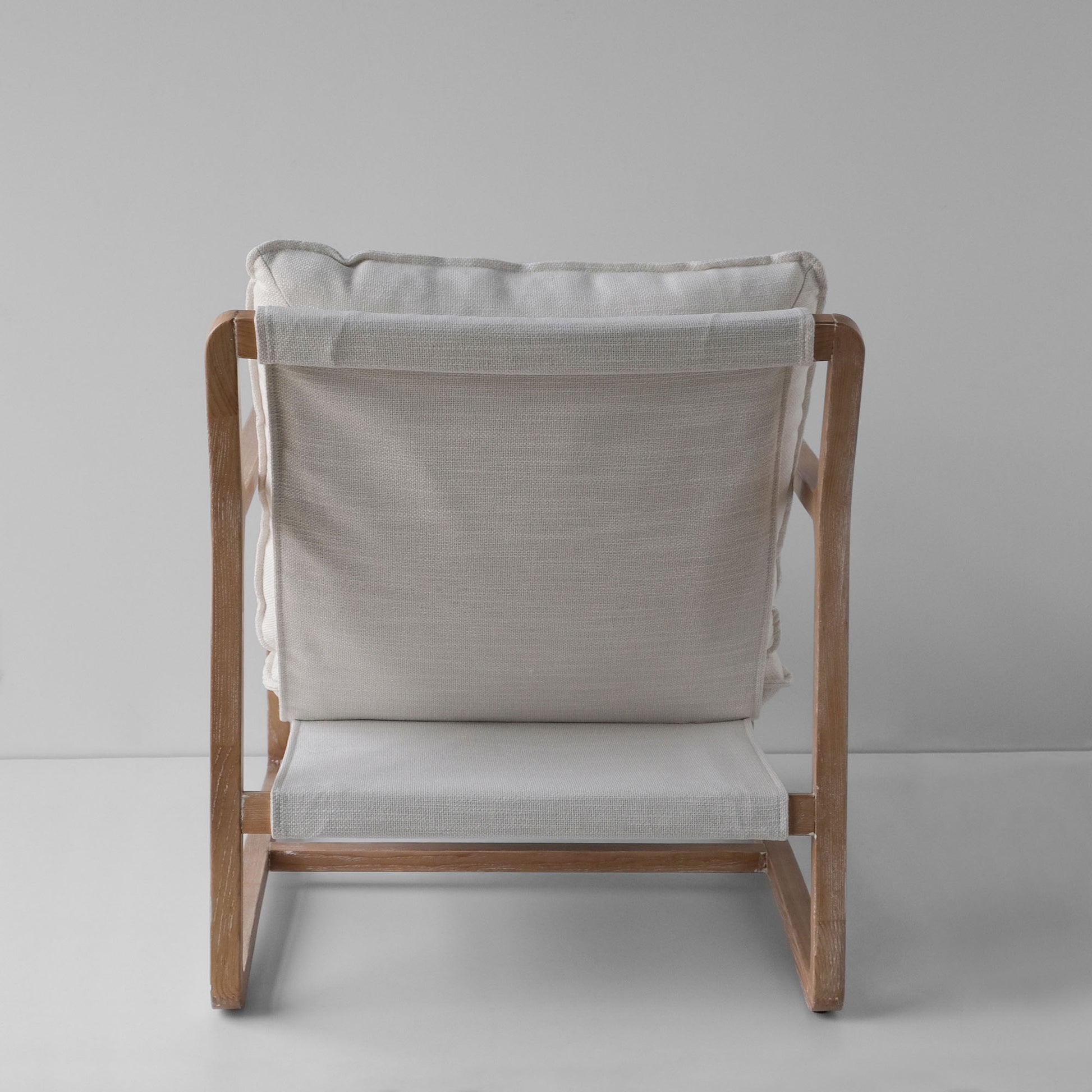Back view of the white wash linen neutral accent chair