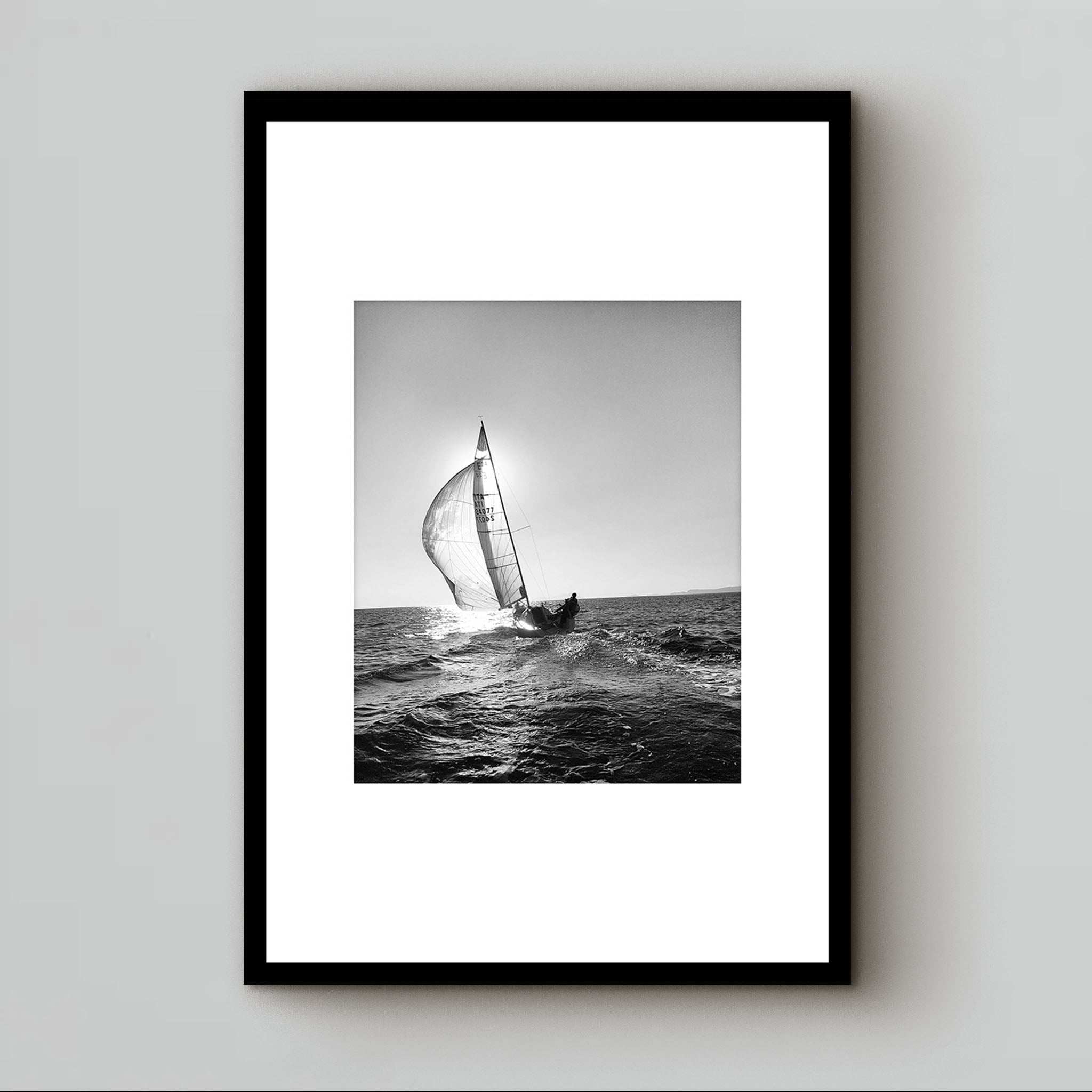 black and white photography under glass of a sunset sailboat