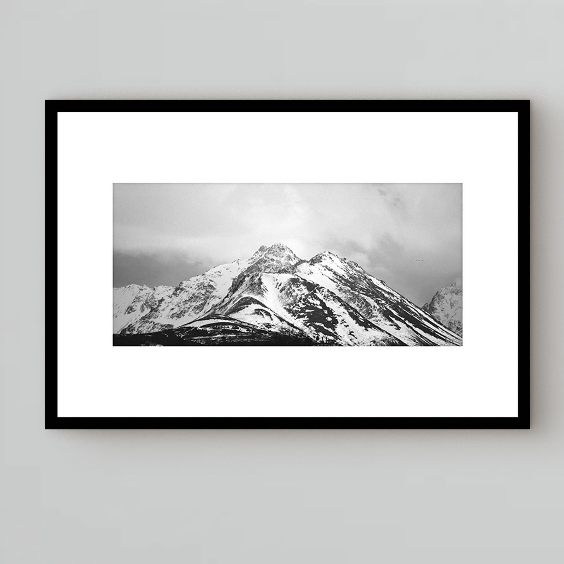 black and white photography under glass of breathtaking mountains