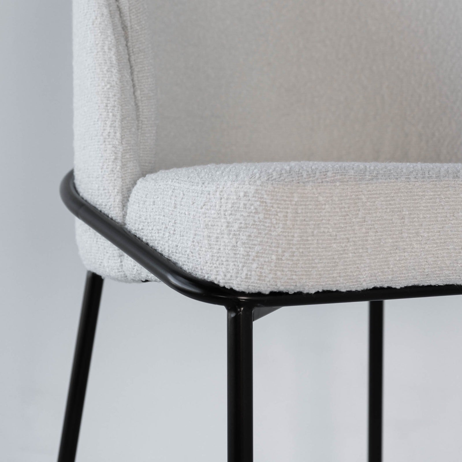 Close up view of boucle dining chair 