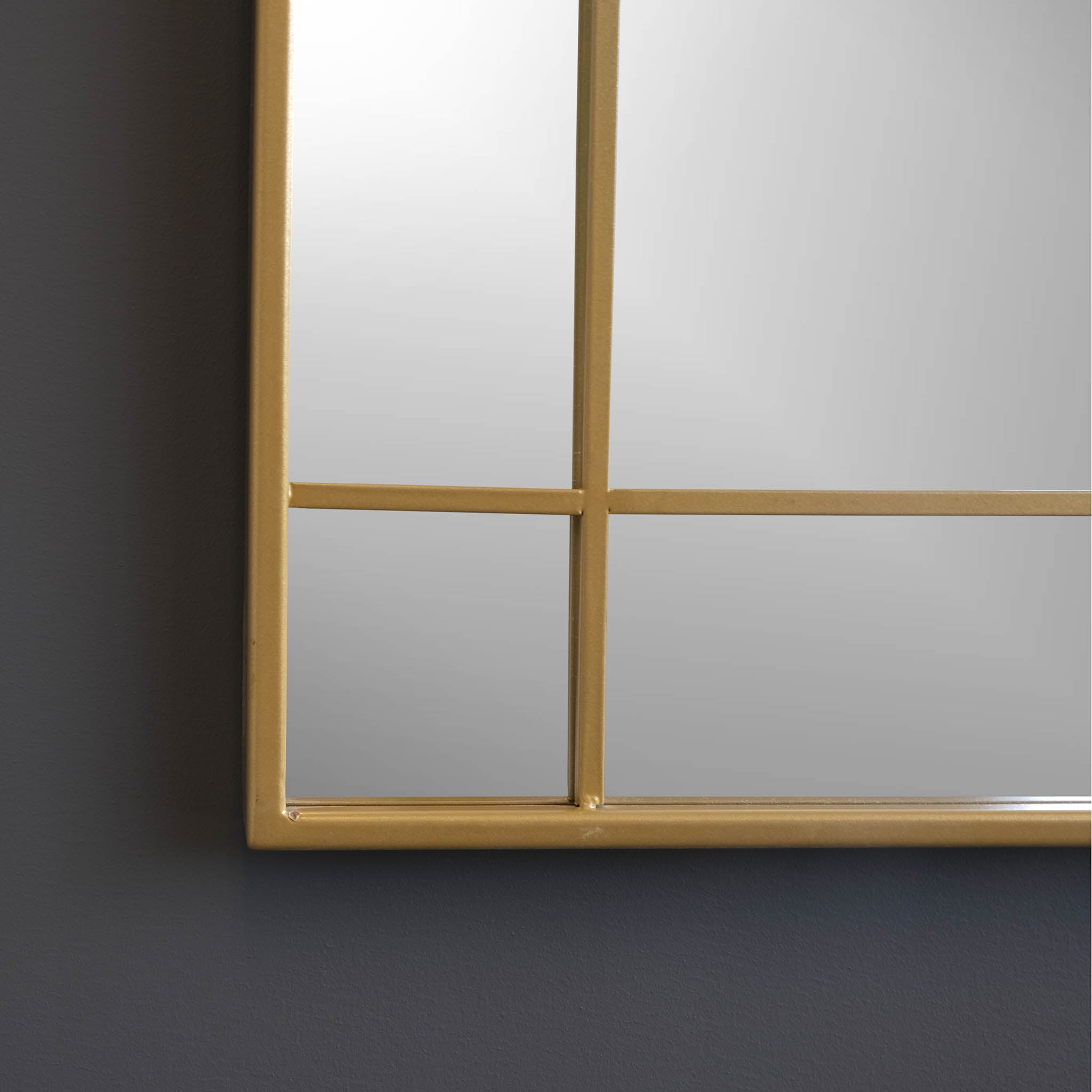 corner view of gold frame mirror