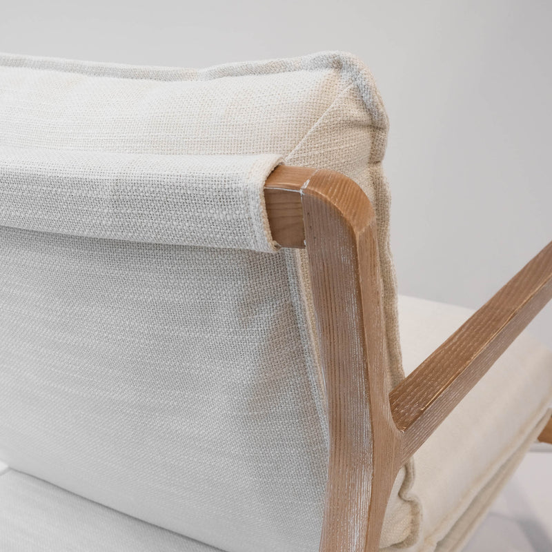 Close up of white wash frame on linen lounger