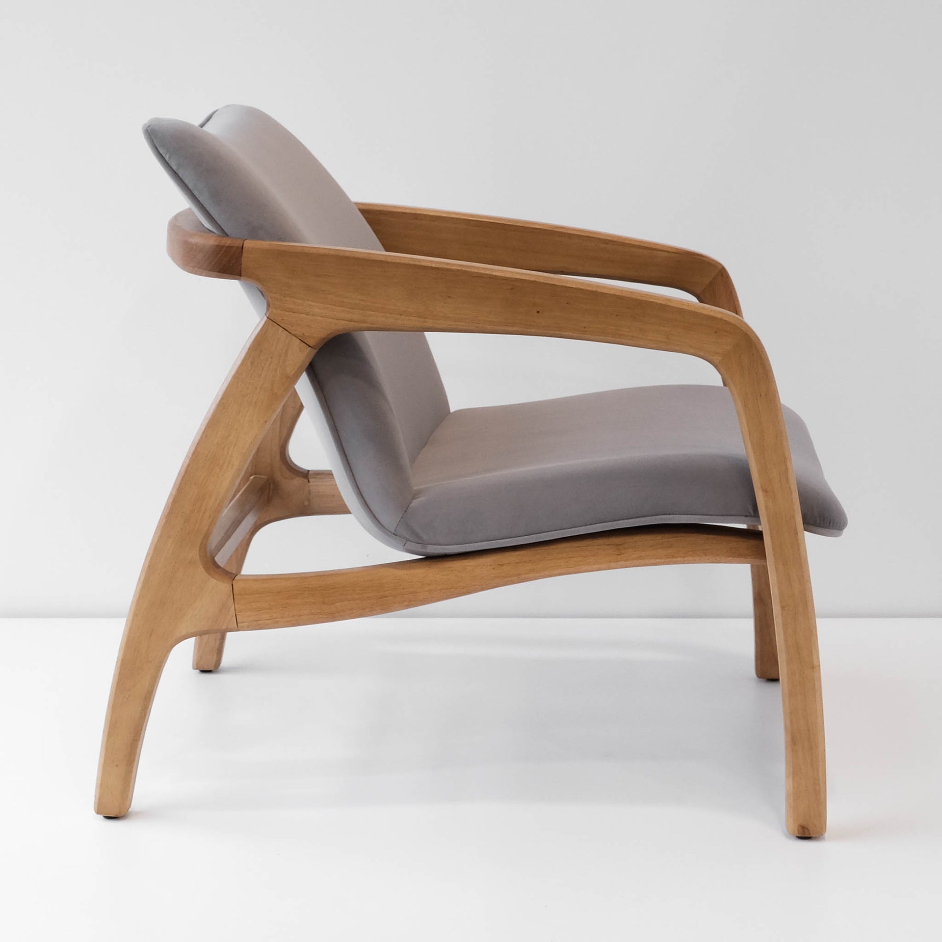 Side view of a clean lined Danish design accent chair