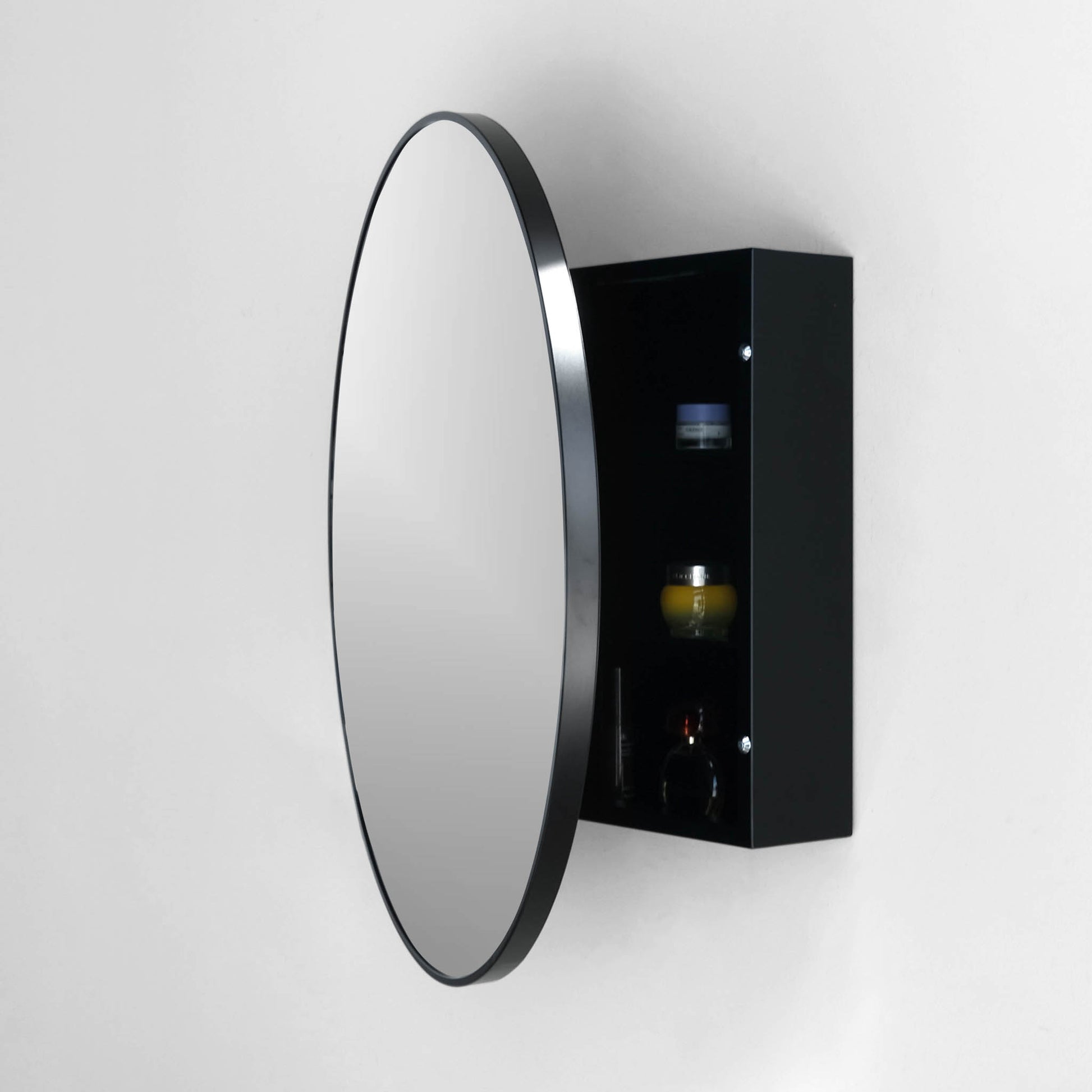 open view of round black medicine cabinet showing 3 shelves