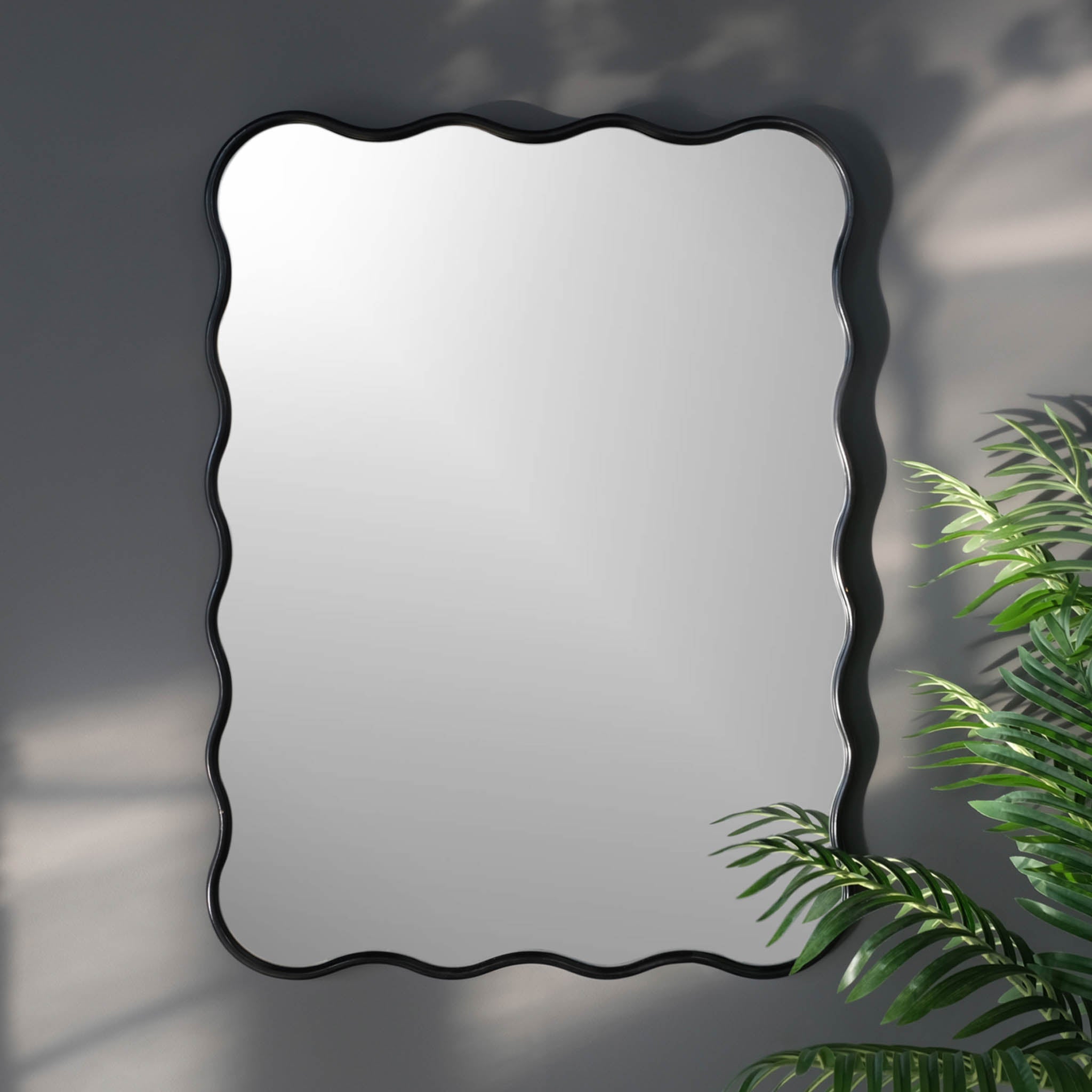 Black framed leafed unique mirror