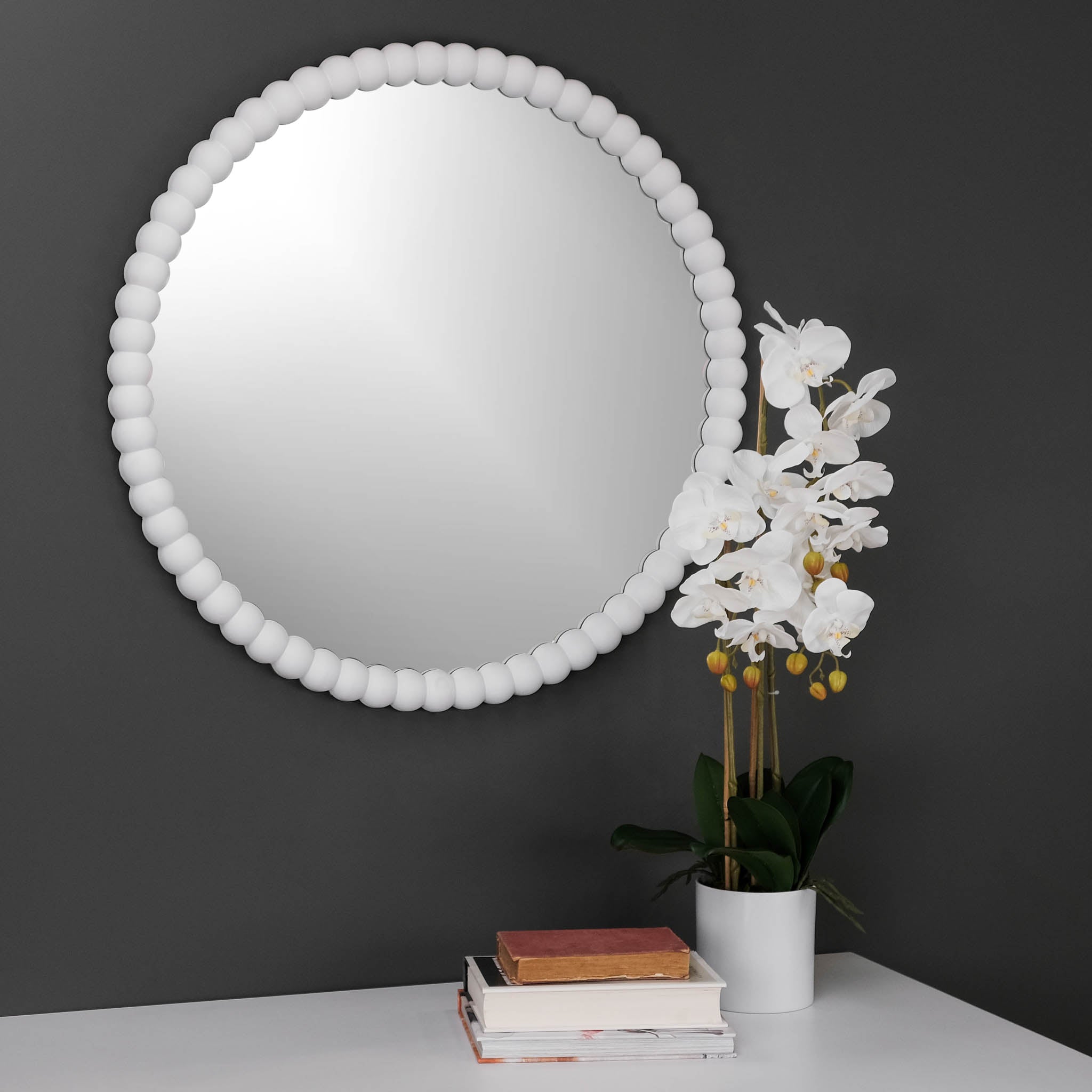 Side view of white wash round ball mirror